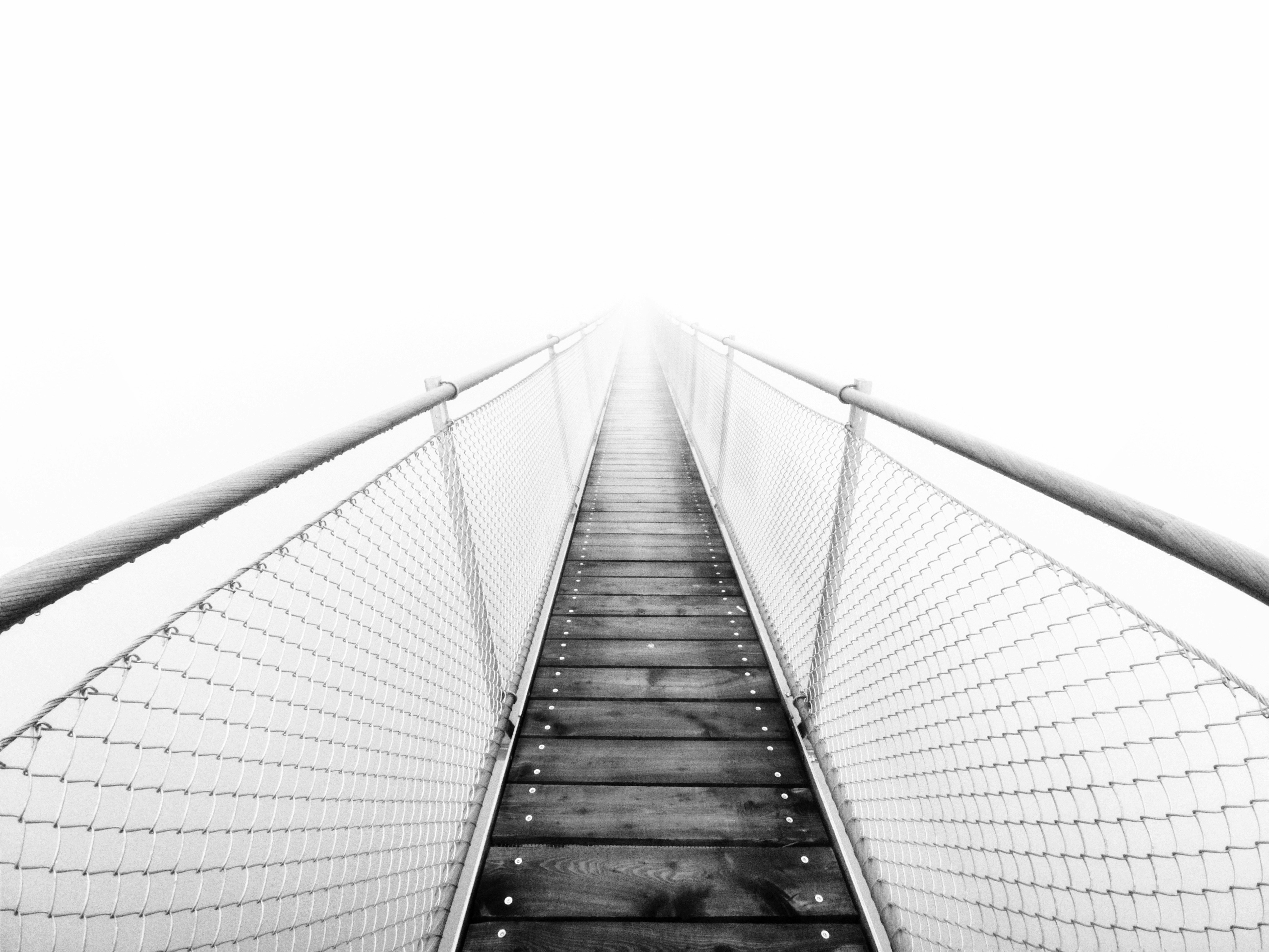 Stairs leading into infinite white void.